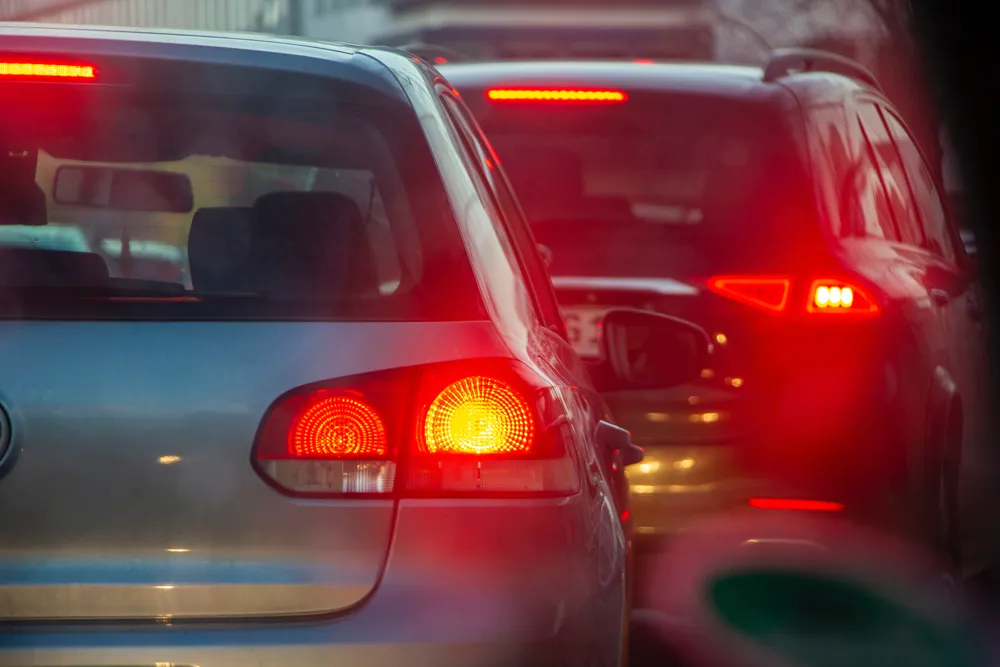 Tail lights of two cars in traffic